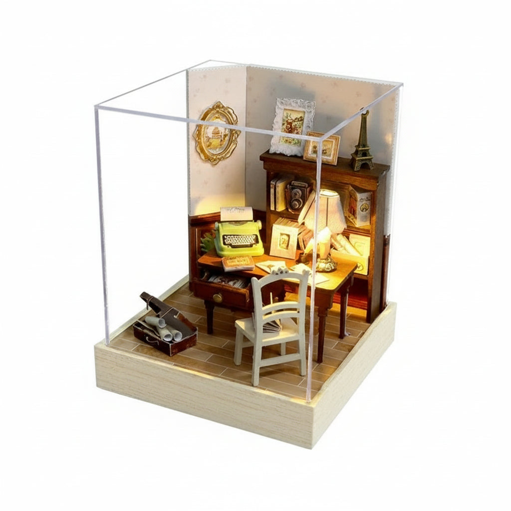 Miniature model of a study room with furniture and decor, enclosed in a glass case with dimensions indicated.