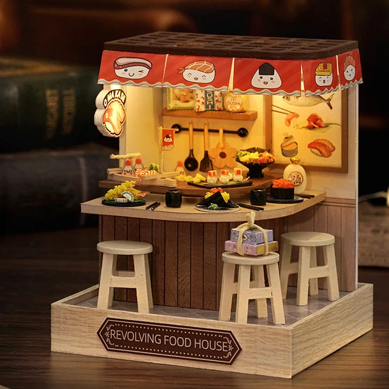 Wooden revolving food house model with stools and miniature food items on a dark background