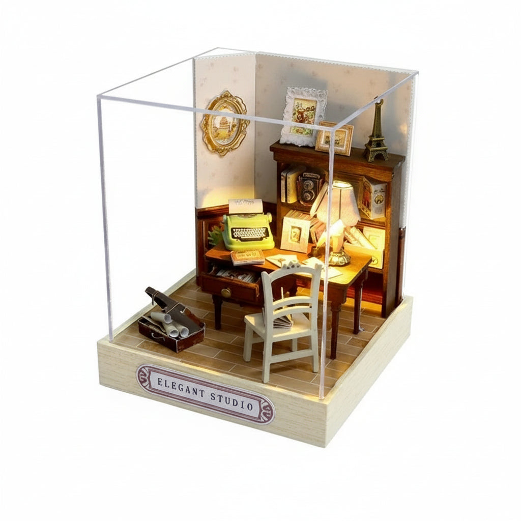 Miniature model of a study room with furniture and decor, enclosed in a glass case with dimensions indicated.