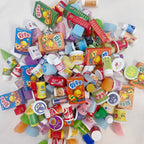 Assorted miniature food packages on a white background