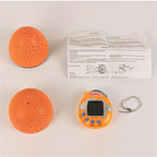 Orange toy with textured surface, instruction manual, and keychain on a white background