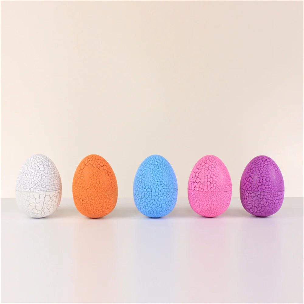 Five textured eggs in different colors on a light background