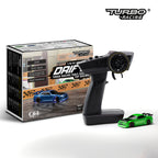 Turbo Racing RC car transmitter with packaging and a small green model car on a white background