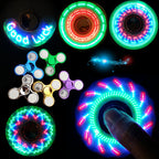 Collection of LED fidget spinners and rings on a dark background