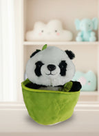 Plush panda toy in a green bag on a white background