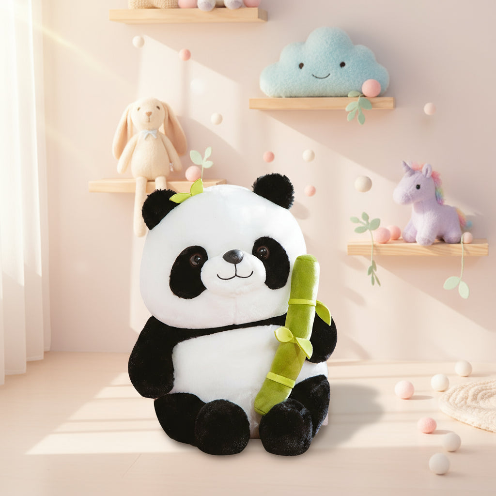 Plush panda toy holding a bamboo stick on a white background