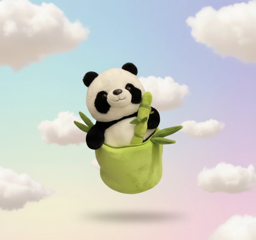 Person holding a plush panda toy with bamboo