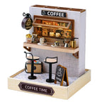 Miniature coffee shop set with furniture and decor on a white background