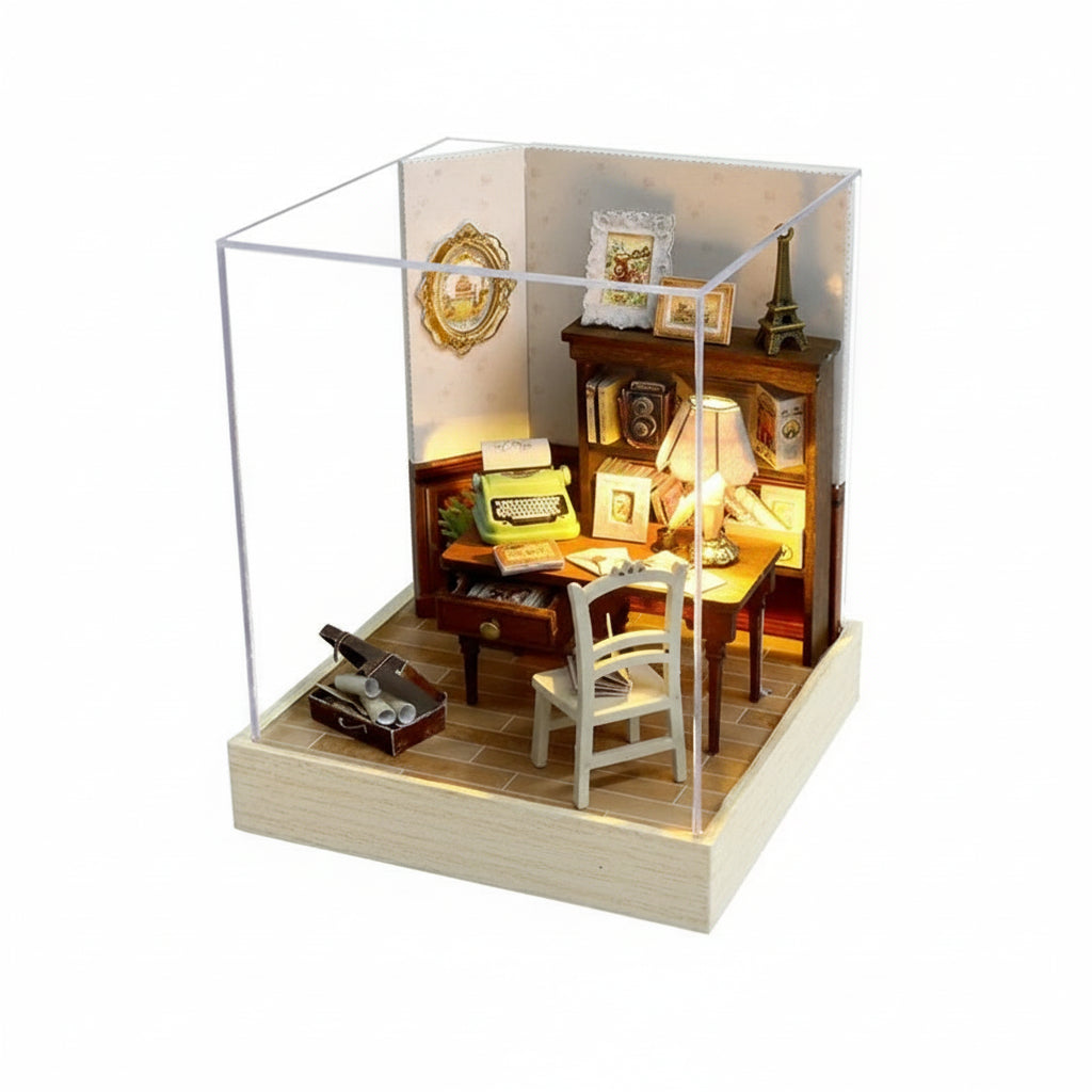 Miniature model of a study room with furniture and decor, enclosed in a glass case with dimensions indicated.