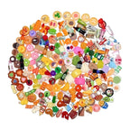 Assorted colorful miniature food items arranged in a circular pattern on a white background