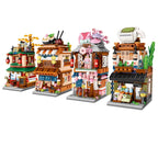 Set of toy buildings resembling a Japanese street scene on a white background