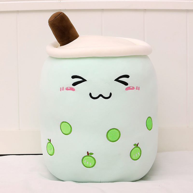 Cute plush toy resembling a bubble tea with a smiling face on a white background