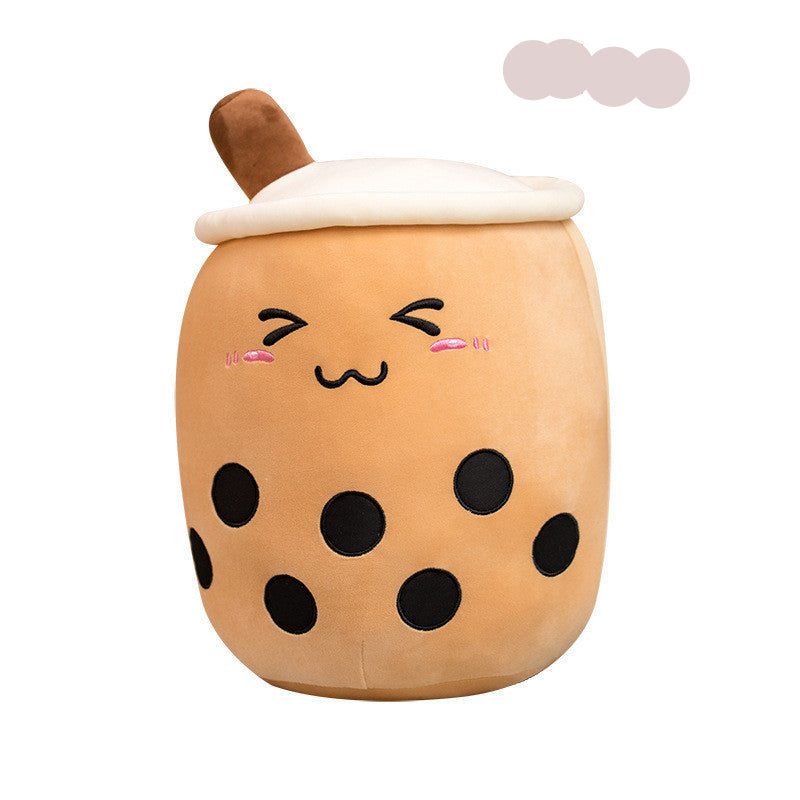 Plush toy shaped like a bubble tea with a face on a white background