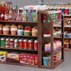 Miniature shelves with various food and drink items on a gray background