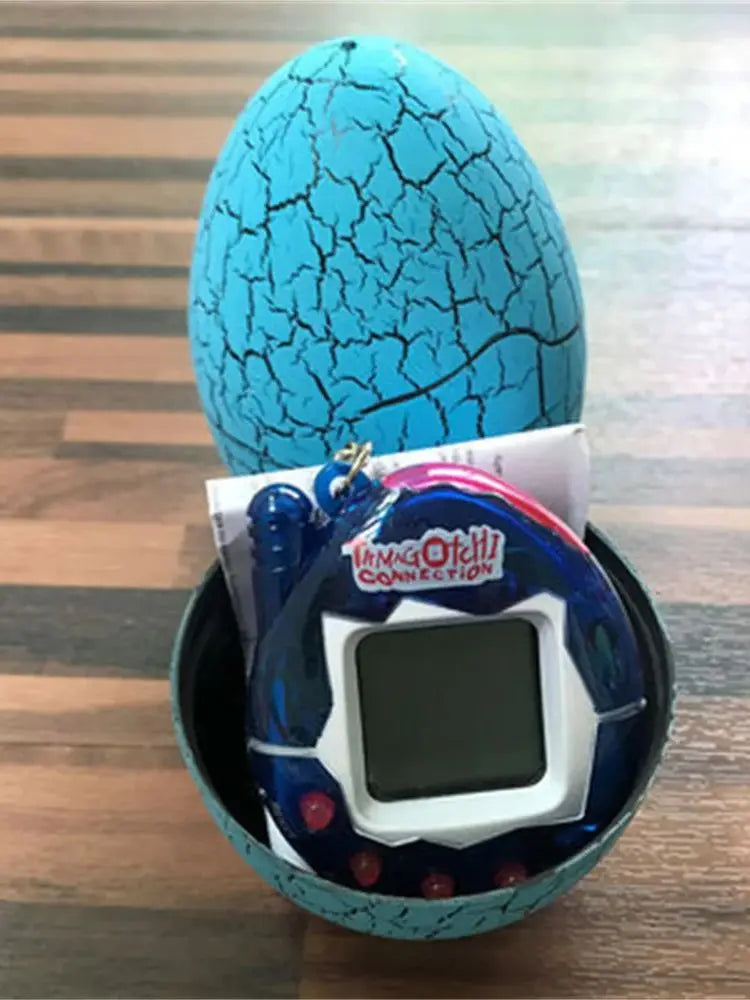 Hatchimals CollEGGtibles toy with Tamagotchi-like device on a wooden surface